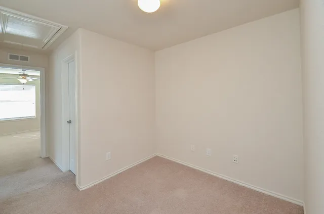 a view of a house with backyard and a tree