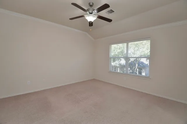 an aerial view of a house with a yard and lake view