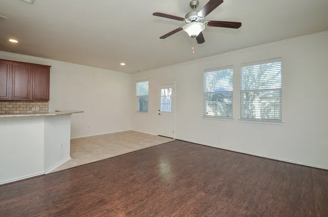 a kitchen with stainless steel appliances granite countertop a refrigerator a stove top oven a sink and dishwasher