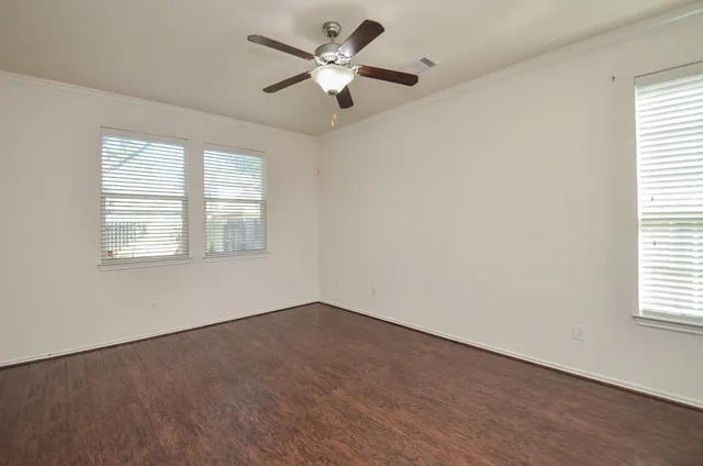 a large kitchen with stainless steel appliances granite countertop a stove a sink and a microwave