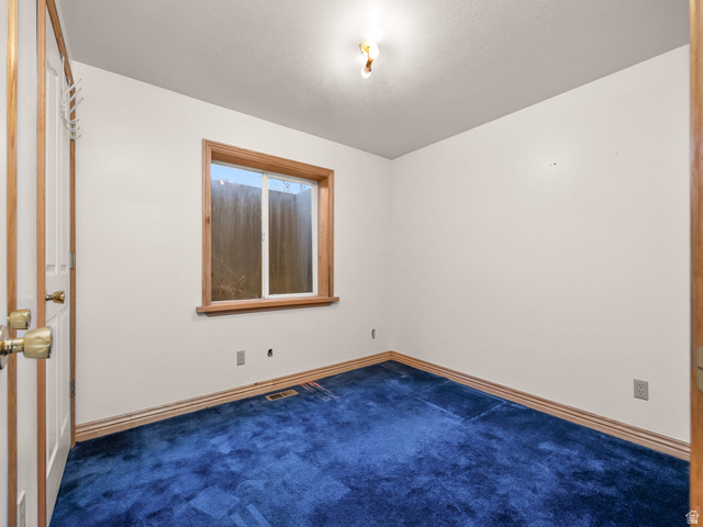 598 West 1600th Street North Mapleton, UT 84664 - Photo 14 of 34 Unfurnished room with dark colored carpet and baseboards