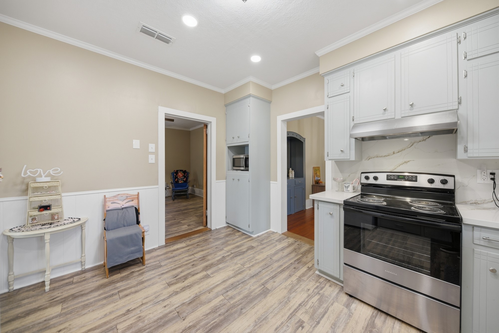 1501 South Austin Street Brenham, TX 77833 - Photo 7 of 36 a kitchen with a stove and a refrigerator