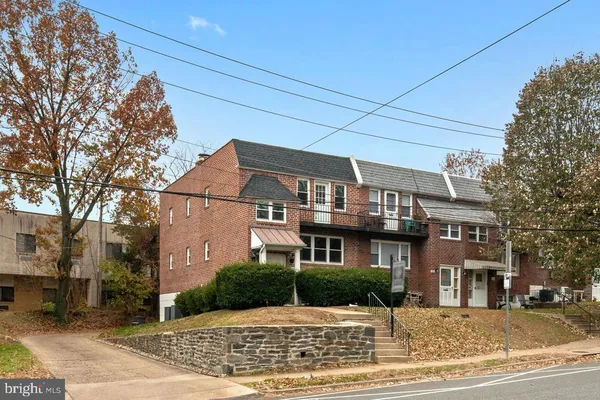 a front view of residential houses and street