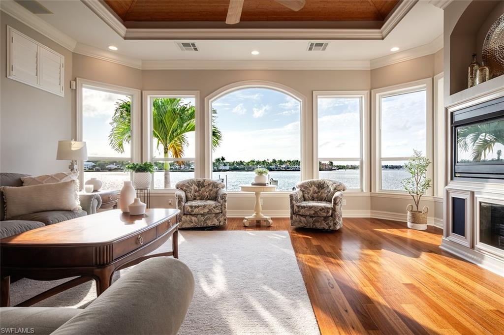 1942 Kingfish Road Naples, FL 34102 - Photo 11 of 43 a living room with furniture and a large window