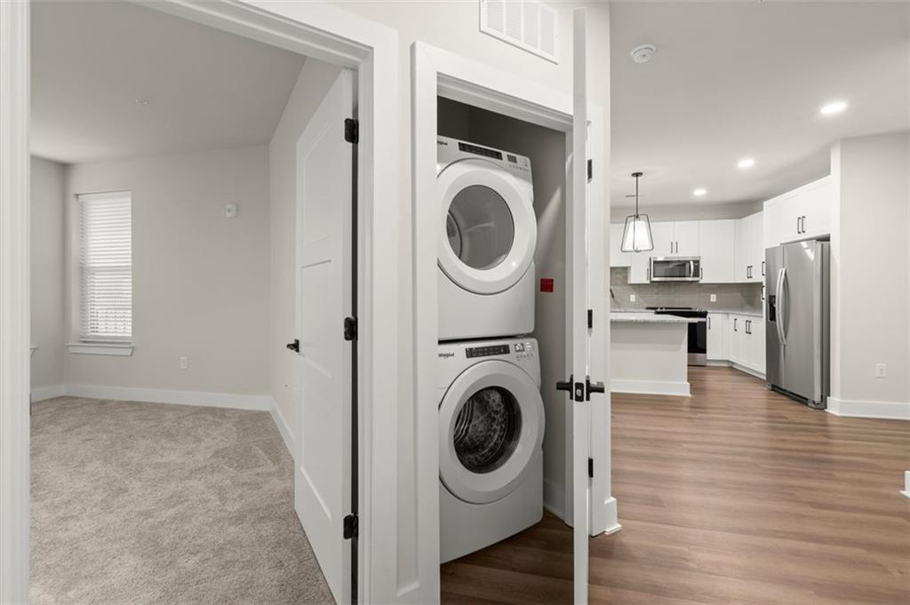 2648 Sandy Plains Road, Unit 137 Marietta, GA 30062 - Photo 15 of 38 a view of a kitchen with washer and dryer
