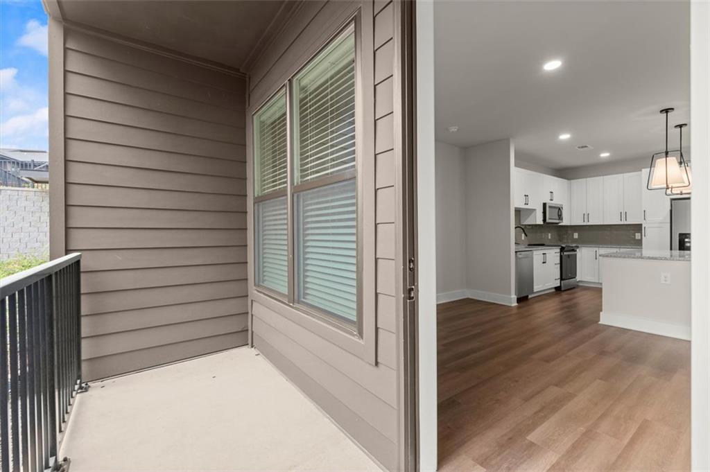 2648 Sandy Plains Road, Unit 137 Marietta, GA 30062 - Photo 26 of 38 a view of kitchen with wooden floor and kitchen