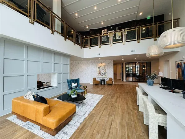 a living room with fireplace furniture and a wooden floor