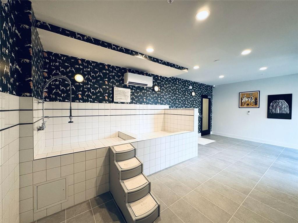 2648 Sandy Plains Road, Unit 137 Marietta, GA 30062 - Photo 35 of 38 a bathroom with a sink a toilet and shower