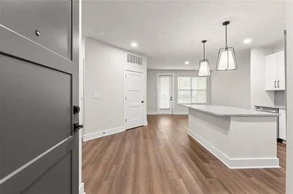 a view of kitchen with wooden floor and window