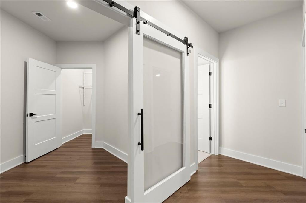 2648 Sandy Plains Road, Unit 137 Marietta, GA 30062 - Photo 10 of 38 a view of hallway with wooden floor