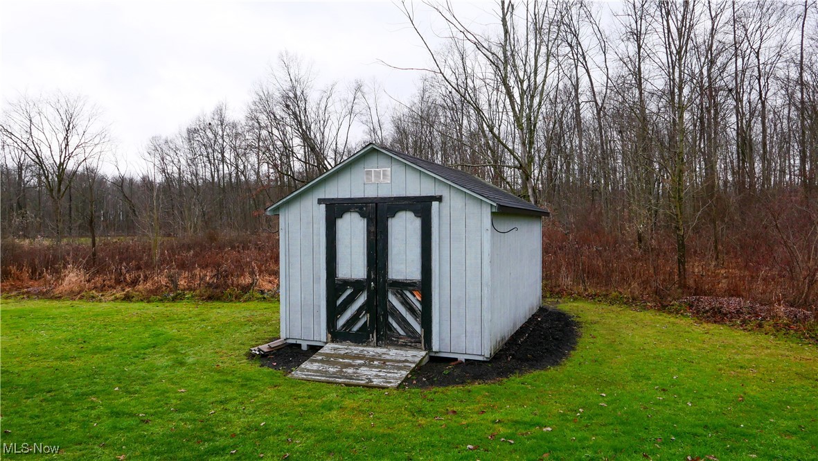 17296 Old State Road Middlefield, OH 44062 - Photo 36 of 44 View of outdoor structure featuring a lawn