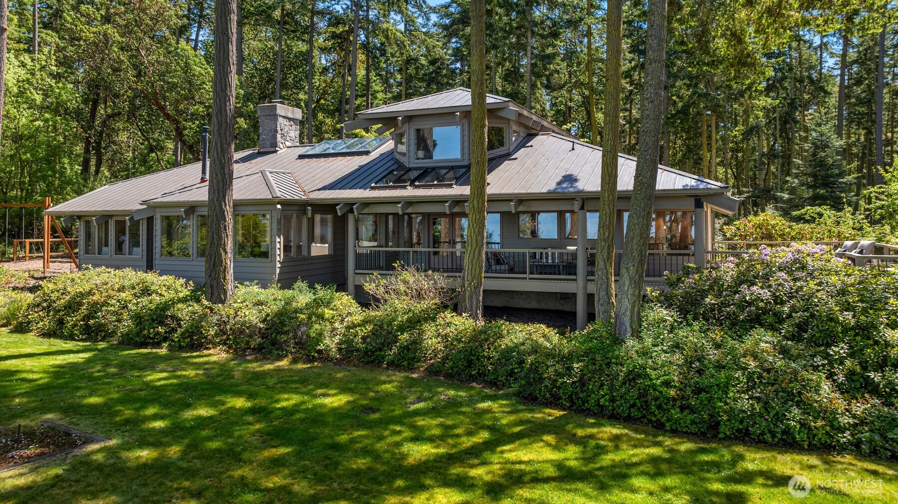 4065 East Sequim Bay Road, Unit 12 Sequim, WA 98382 - Photo 2 of 40 front view of a house with a yard