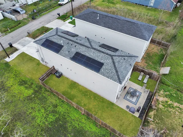 an aerial view of a house with a garden