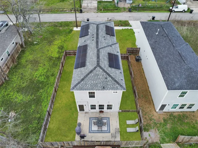 an aerial view of a house with a garden