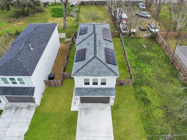 an aerial view of a house with a garden