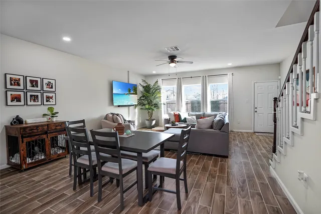 a view of a dining room with furniture and wooden floor