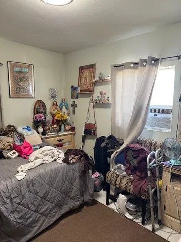 a room with furniture closet and a window