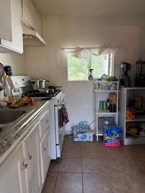 3219 East Huntsman Avenue, Unit 2 Fresno, CA 93725 - Photo 17 of 26 a kitchen with a sink and cabinets