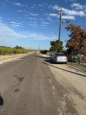 a view of a street with an ocean view
