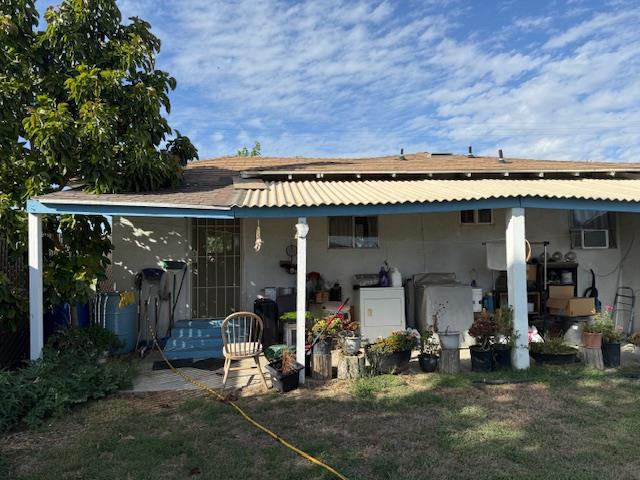 3219 East Huntsman Avenue, Unit 2 Fresno, CA 93725 - Photo 5 of 26 a view of a chairs in front of building