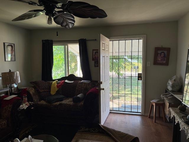 3219 East Huntsman Avenue, Unit 2 Fresno, CA 93725 - Photo 8 of 26 a living room with furniture and a flat screen tv