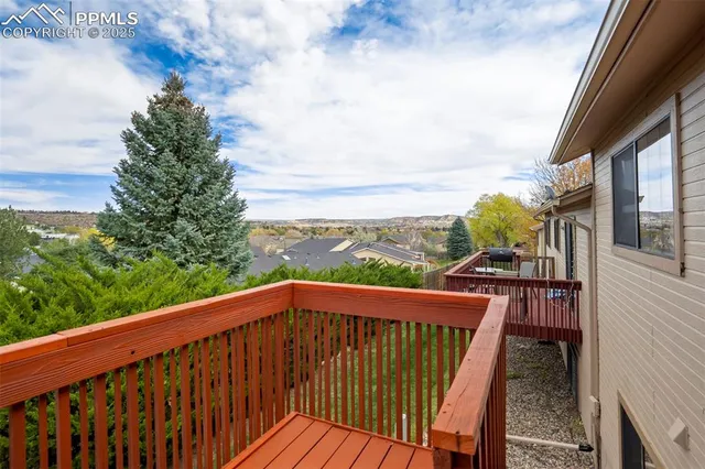 a kitchen with stainless steel appliances a sink a stove a refrigerator cabinets and a counter top space