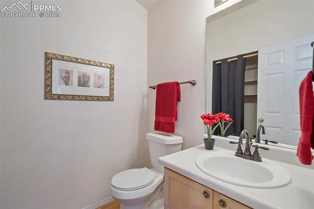 a bathroom with a sink vanity and a mirror