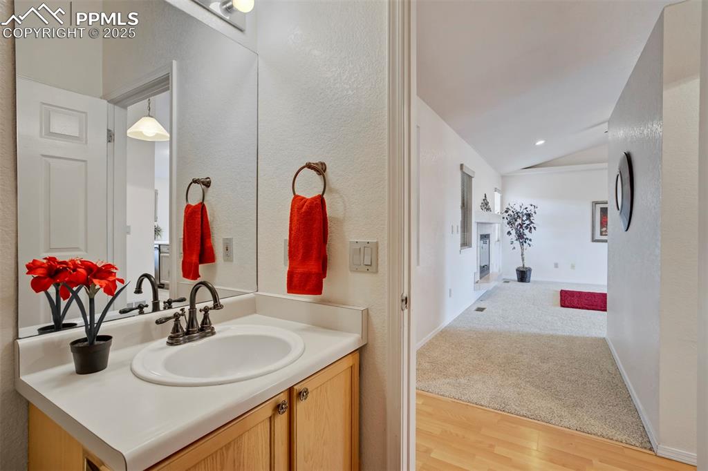1528 Shane Circle Colorado Springs, CO 80907 - Photo 18 of 39 a bathroom with a sink vanity and a mirror