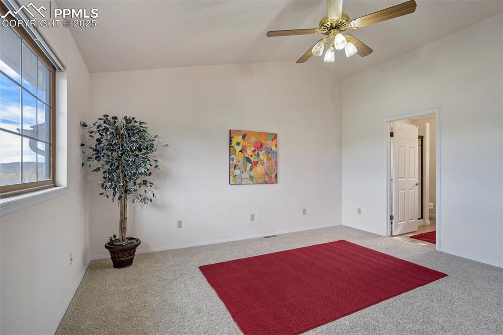 1528 Shane Circle Colorado Springs, CO 80907 - Photo 22 of 39 a view of a room with window and ceiling fan