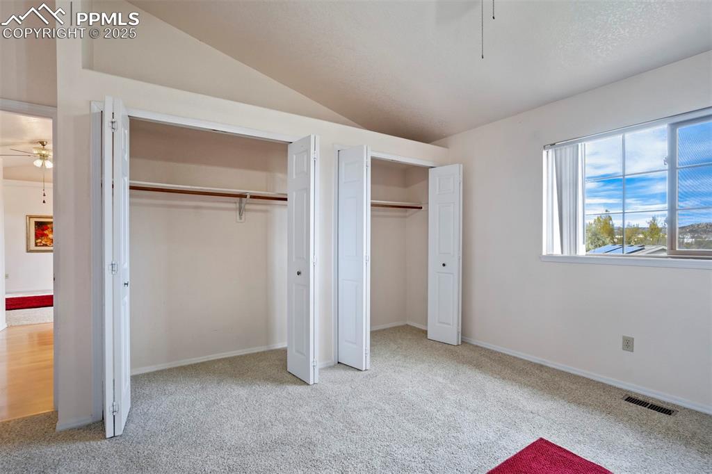 1528 Shane Circle Colorado Springs, CO 80907 - Photo 23 of 39 a view of an empty room with a fireplace