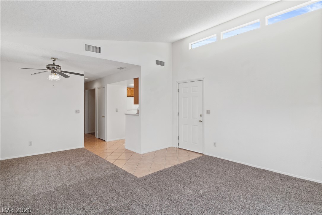 2146 High Dunes Lane Laughlin, NV 89029 - Photo 10 of 64 Family room featuring light colored carpet, ceiling fan, and light tile patterned floors