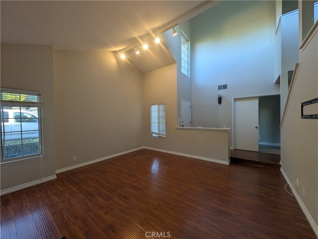 1197 Monte Sereno Drive Thousand Oaks, CA 91360 - Photo 11 of 27 a view of an empty room with wooden floor and a window