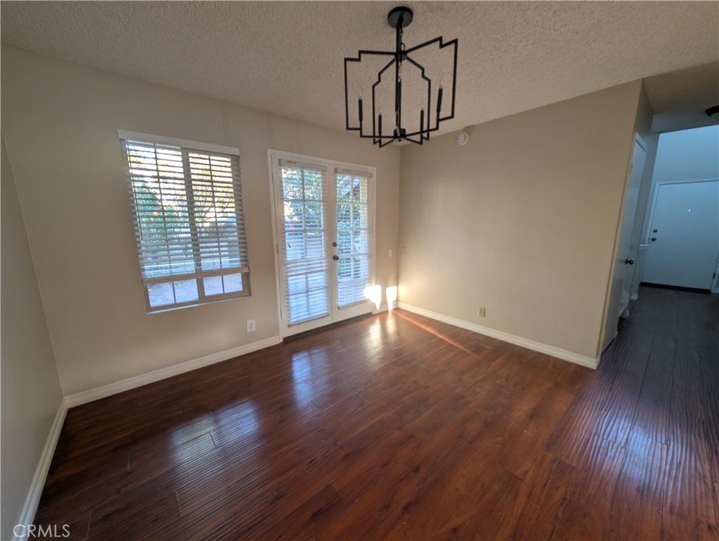 1197 Monte Sereno Drive Thousand Oaks, CA 91360 - Photo 12 of 27 an empty room with wooden floor and windows