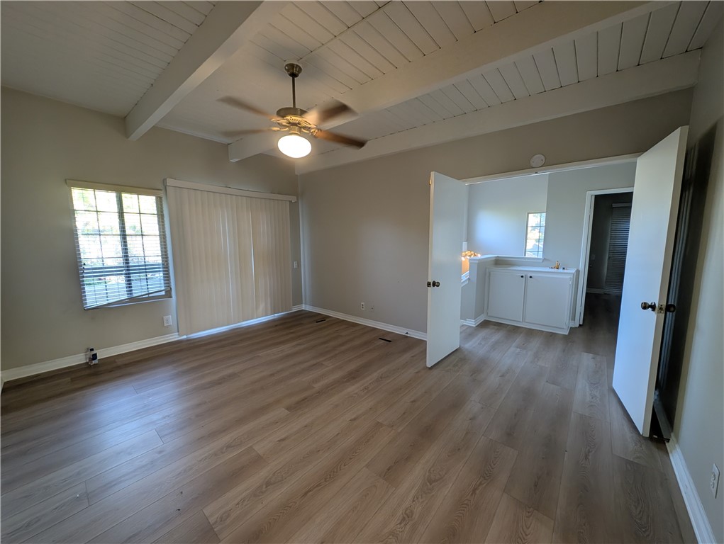 1197 Monte Sereno Drive Thousand Oaks, CA 91360 - Photo 15 of 27 an empty room with wooden floor and windows