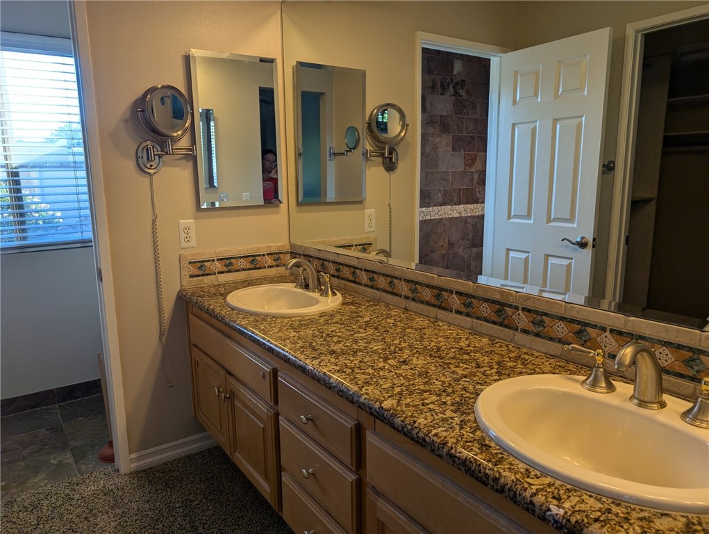 1197 Monte Sereno Drive Thousand Oaks, CA 91360 - Photo 16 of 27 a bathroom with a granite countertop sink and a mirror