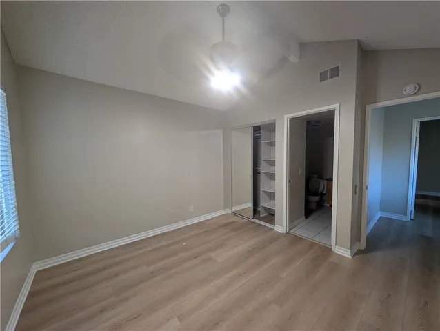 an empty room with closet area