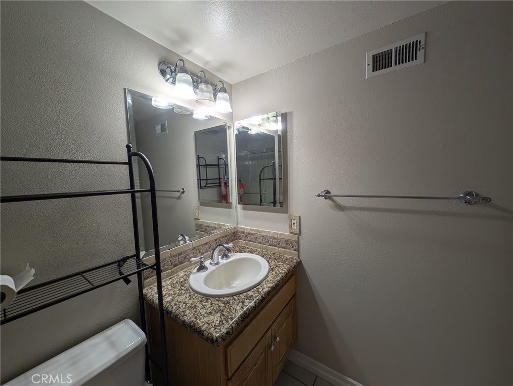 1197 Monte Sereno Drive Thousand Oaks, CA 91360 - Photo 22 of 27 a bathroom with a sink granite and shower