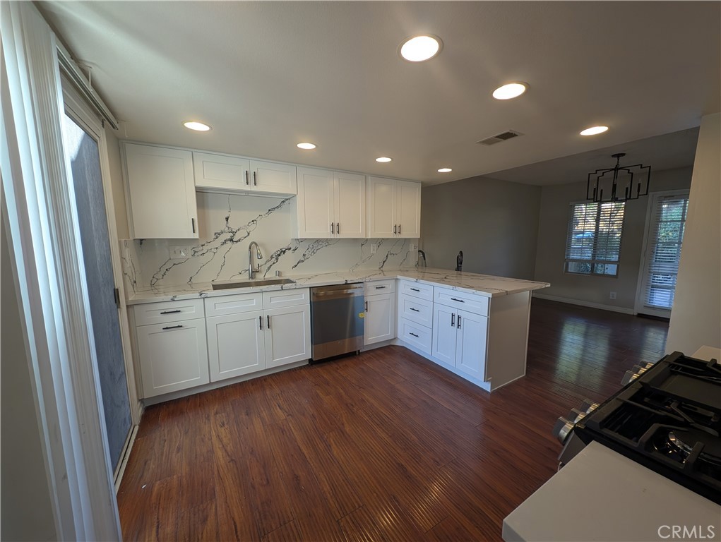 1197 Monte Sereno Drive Thousand Oaks, CA 91360 - Photo 4 of 27 a kitchen with a sink wooden floor and a large window
