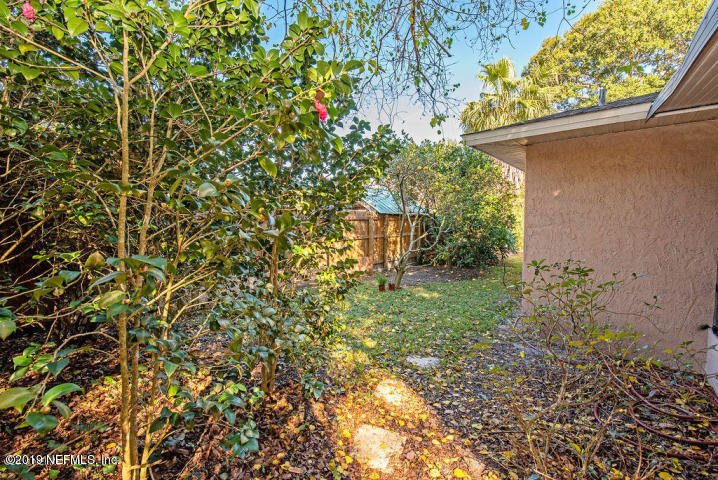 510 Jasmine Road St. Augustine, FL 32086 - Photo 13 of 14 a view of a yard with plants and flowers