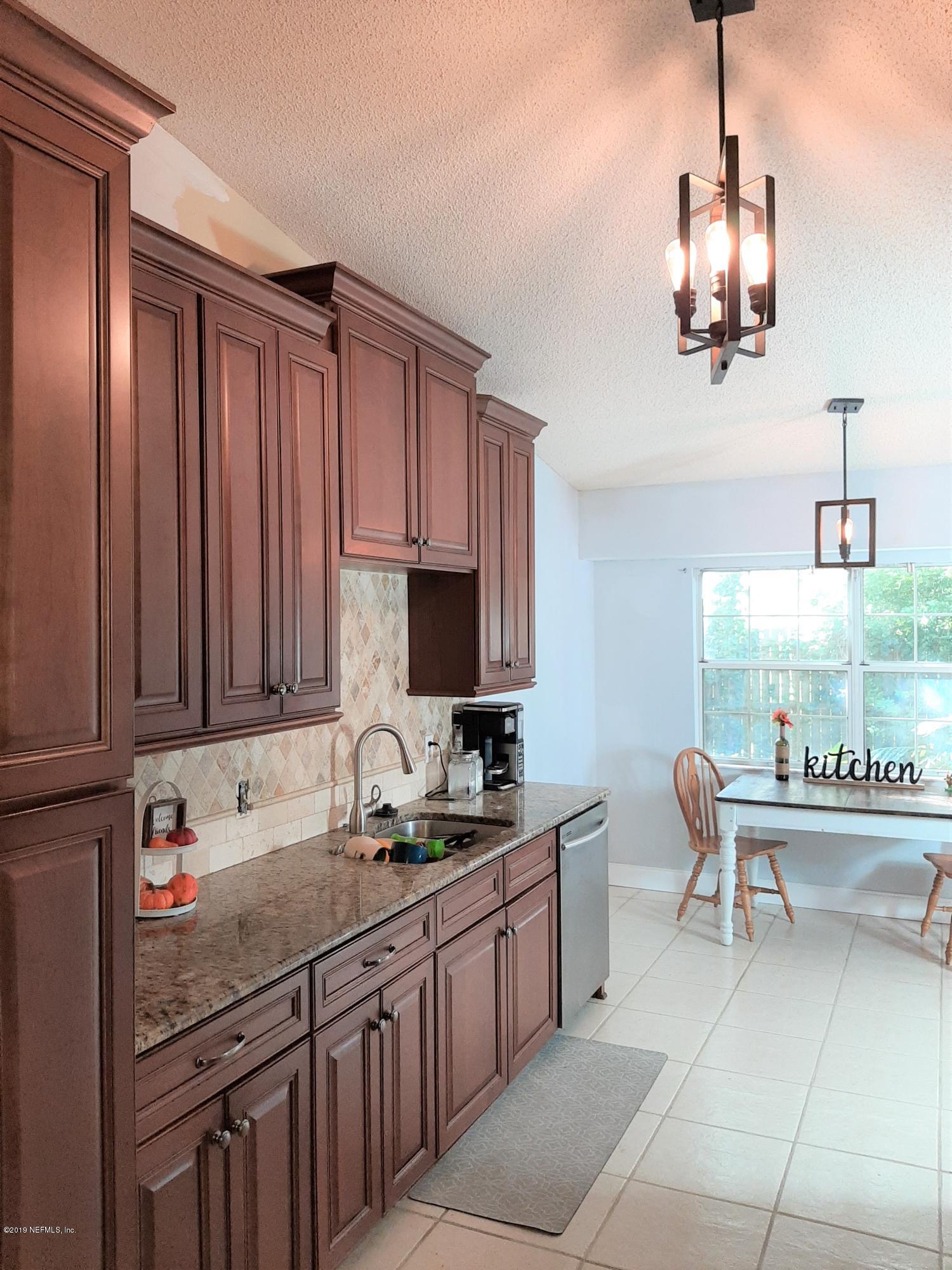 510 Jasmine Road St. Augustine, FL 32086 - Photo 6 of 14 a kitchen with a sink cabinets and window