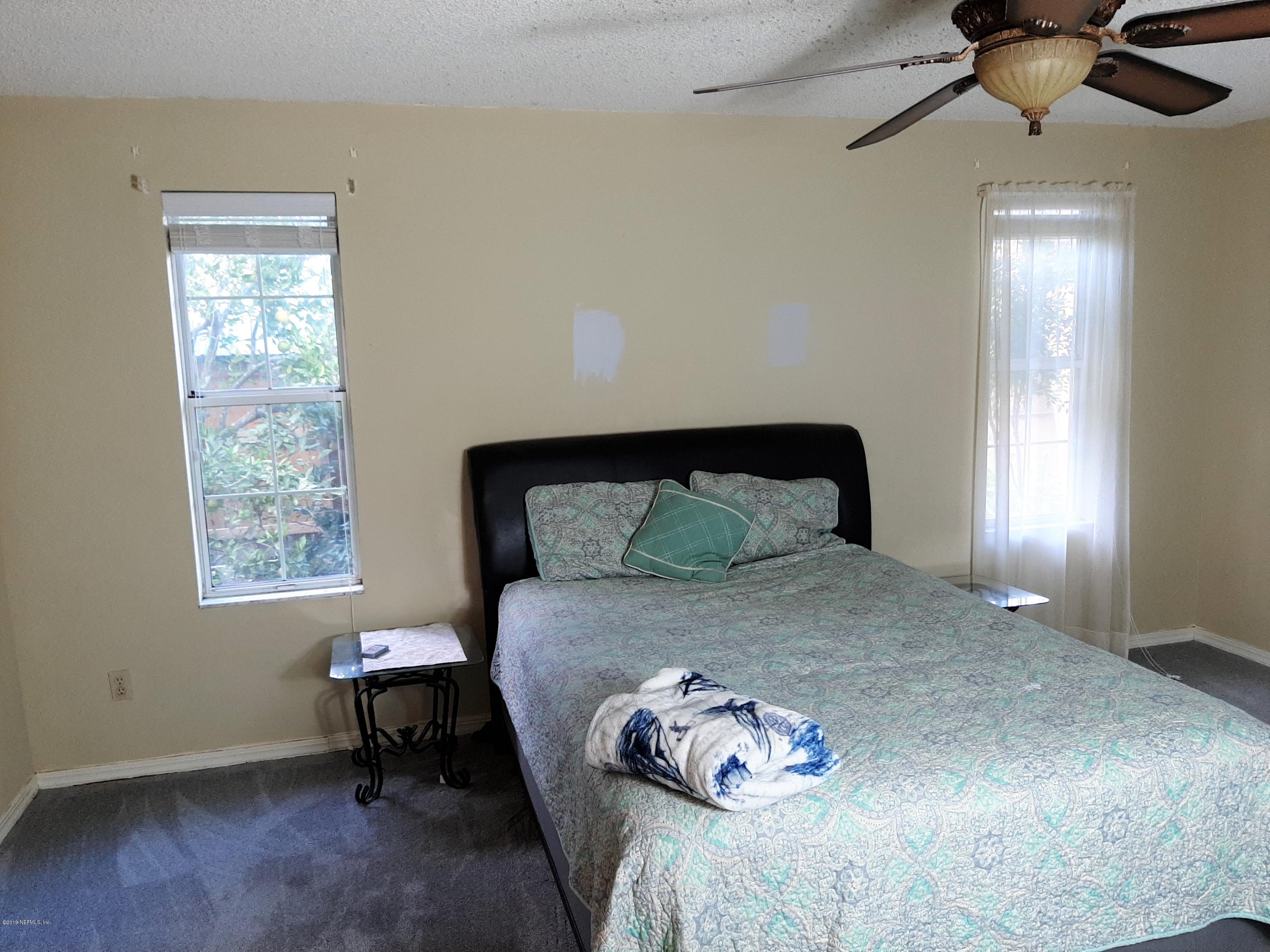 510 Jasmine Road St. Augustine, FL 32086 - Photo 8 of 14 a bedroom with a bed and a window