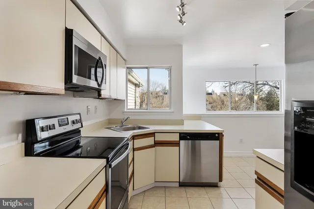 a kitchen that has a sink and a stove