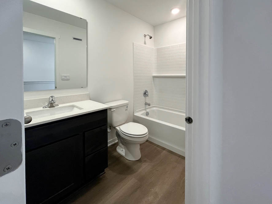 2239 Riesling Road Oswego, IL 60543 - Photo 16 of 49 a bathroom with a toilet a sink and a bathtub