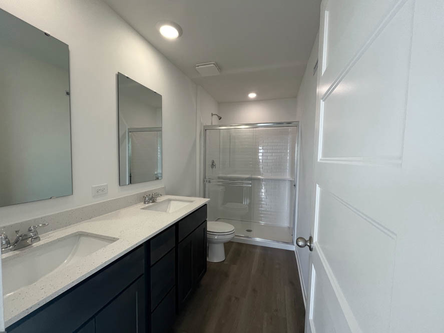 2239 Riesling Road Oswego, IL 60543 - Photo 20 of 49 a bathroom with a sink a toilet and shower