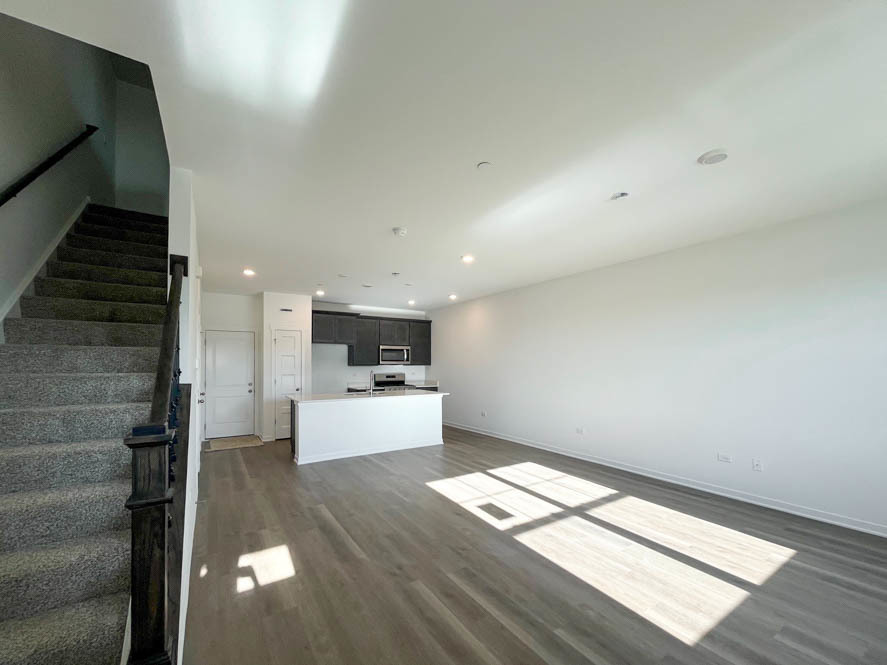 2239 Riesling Road Oswego, IL 60543 - Photo 2 of 49 a view of kitchen and hall with wooden floor