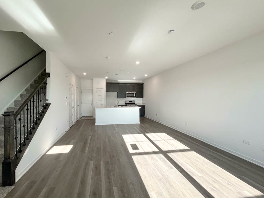 2239 Riesling Road Oswego, IL 60543 - Photo 3 of 49 a view of a hallway with wooden floor and staircase
