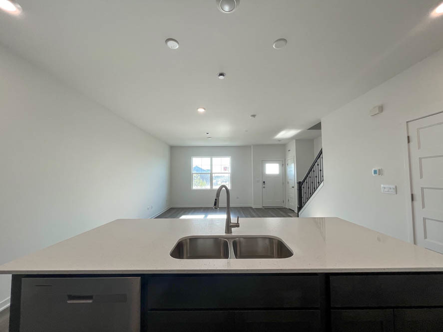 2239 Riesling Road Oswego, IL 60543 - Photo 8 of 49 a kitchen with a sink and a refrigerator