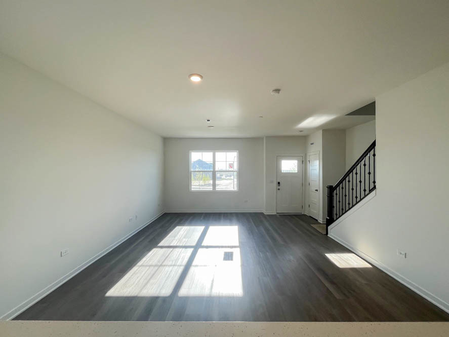2239 Riesling Road Oswego, IL 60543 - Photo 9 of 49 wooden floor in an empty room with a window