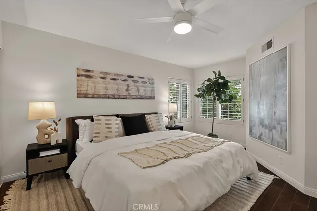 a hallway with a couch and a flat screen tv