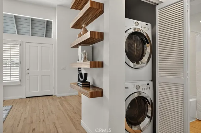 a view of a hallway with washer and dryer